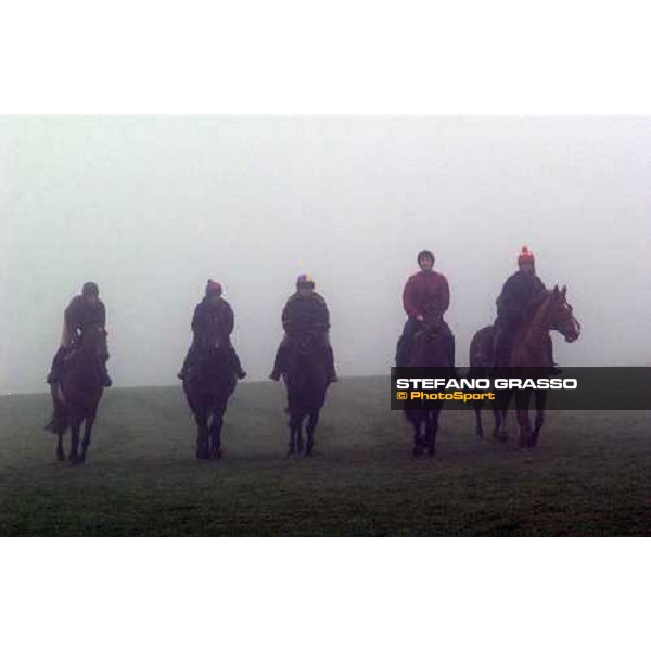 Dr. Philip Pritchard with his stable staff during morning works in a foggy day Purton, Gloucestershire 19th march 2005 Ph. Stefano Grasso